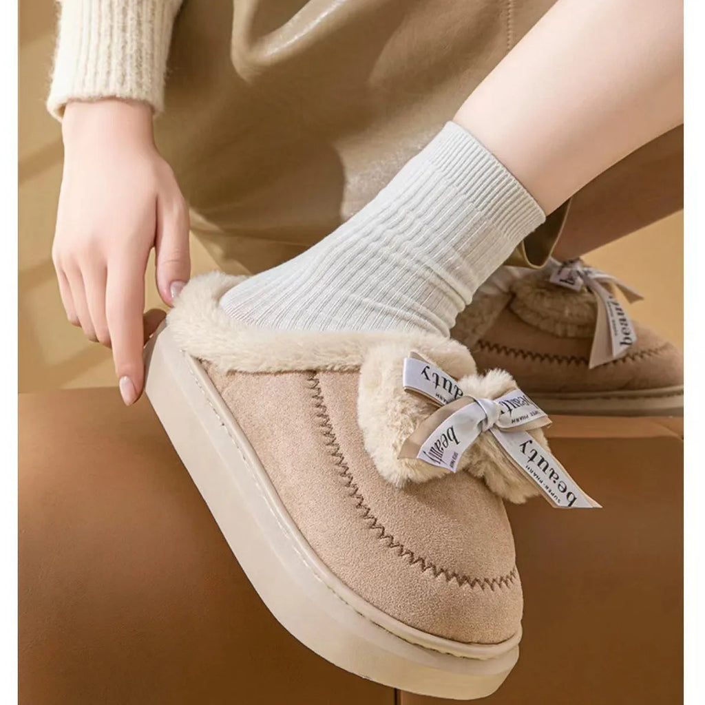 Women's beige suede half slippers with a ribbon bow and thick light-coloured sole