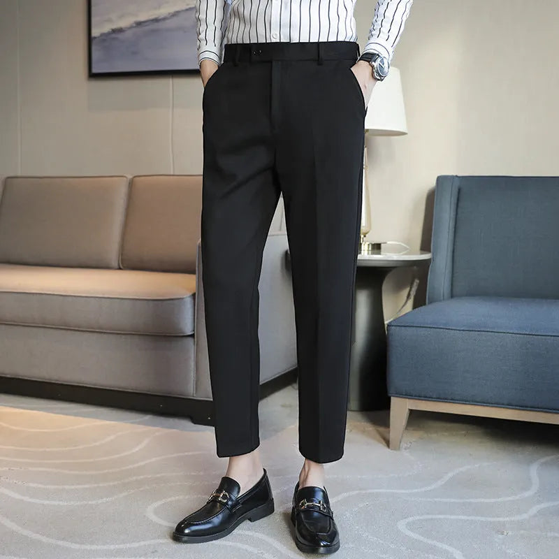 Straight retro brown corduroy trousers with elastic waistband on hanger