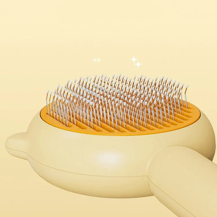 Cat comb massage pet hair removal brush in green with stainless steel bristles on white background