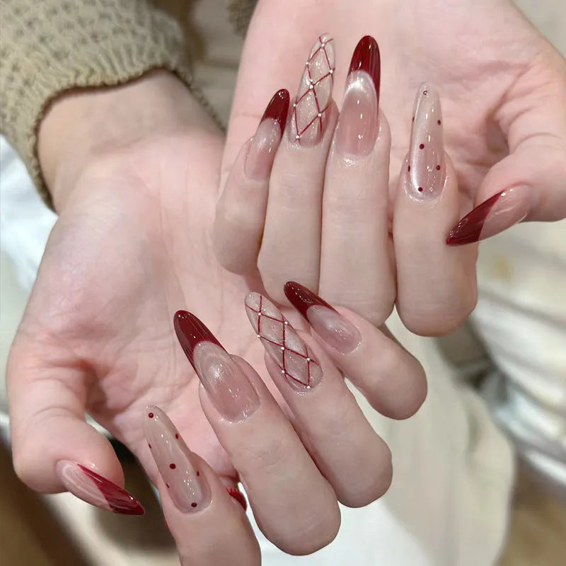 Pack of sweet pastel coloured press-on false nails for girls on a pink background.