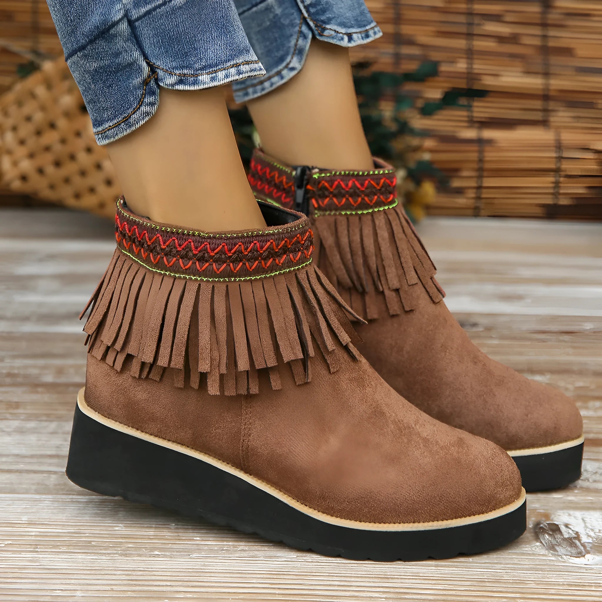 Women's suede wedge ankle boot with side zipper and tassel detail in black