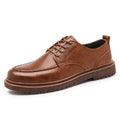 Men's black and brown low top casual leather shoes with round toe and rubber sole.