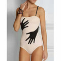 Women's one-piece bikini swimsuit with a gauze skirt in polyester fabric.