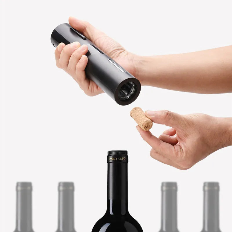 New Base five-in-one electric bottle opener set with black ABS decanter, vacuum stopper, foil knife, and storage base