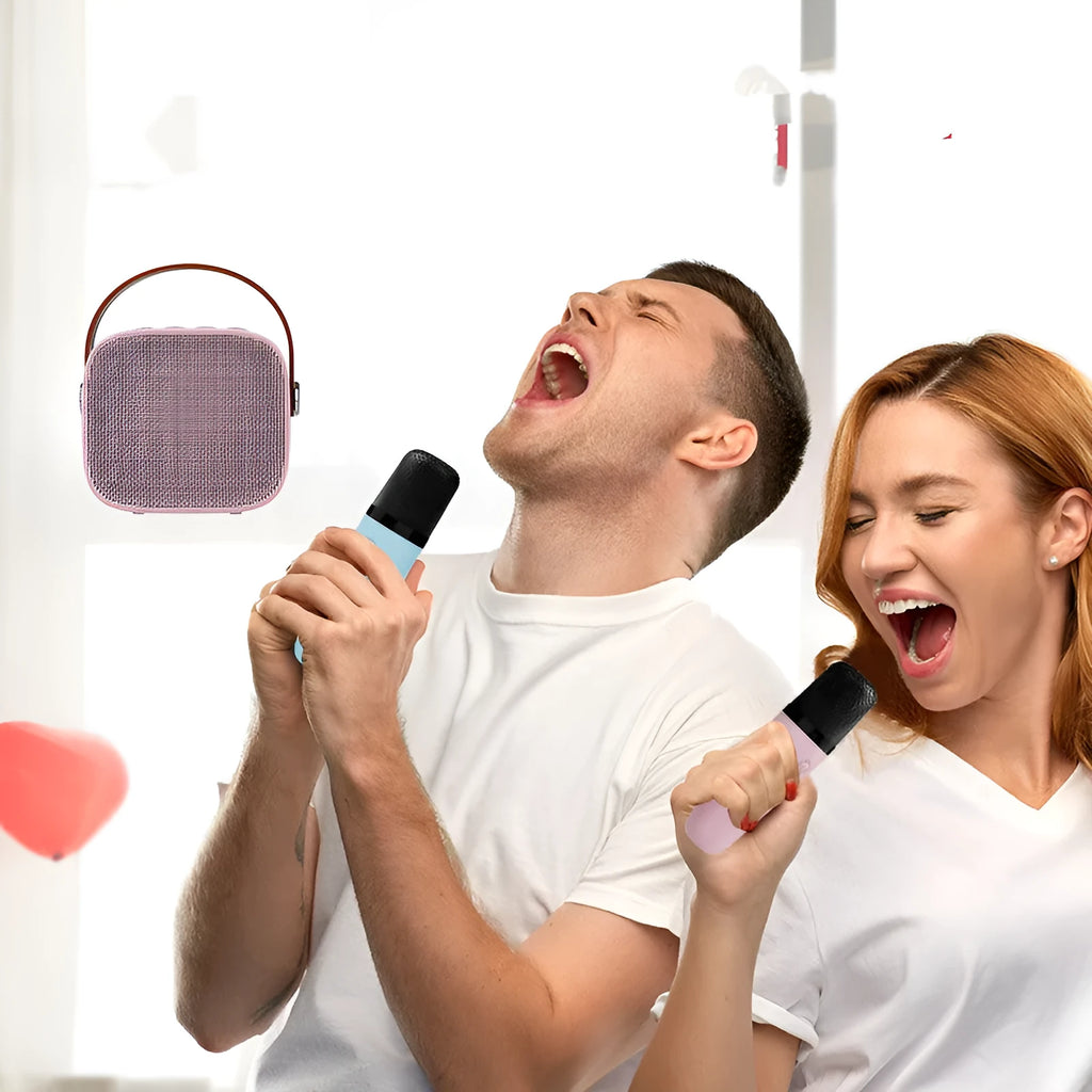 Compact white, pink, or blue plastic portable Bluetooth speaker with microphone on a surface.