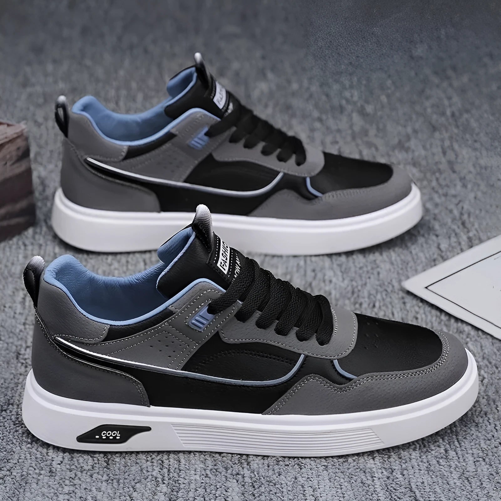 Men's low-top canvas board shoes in black, beige, or grey with leather stitching details.