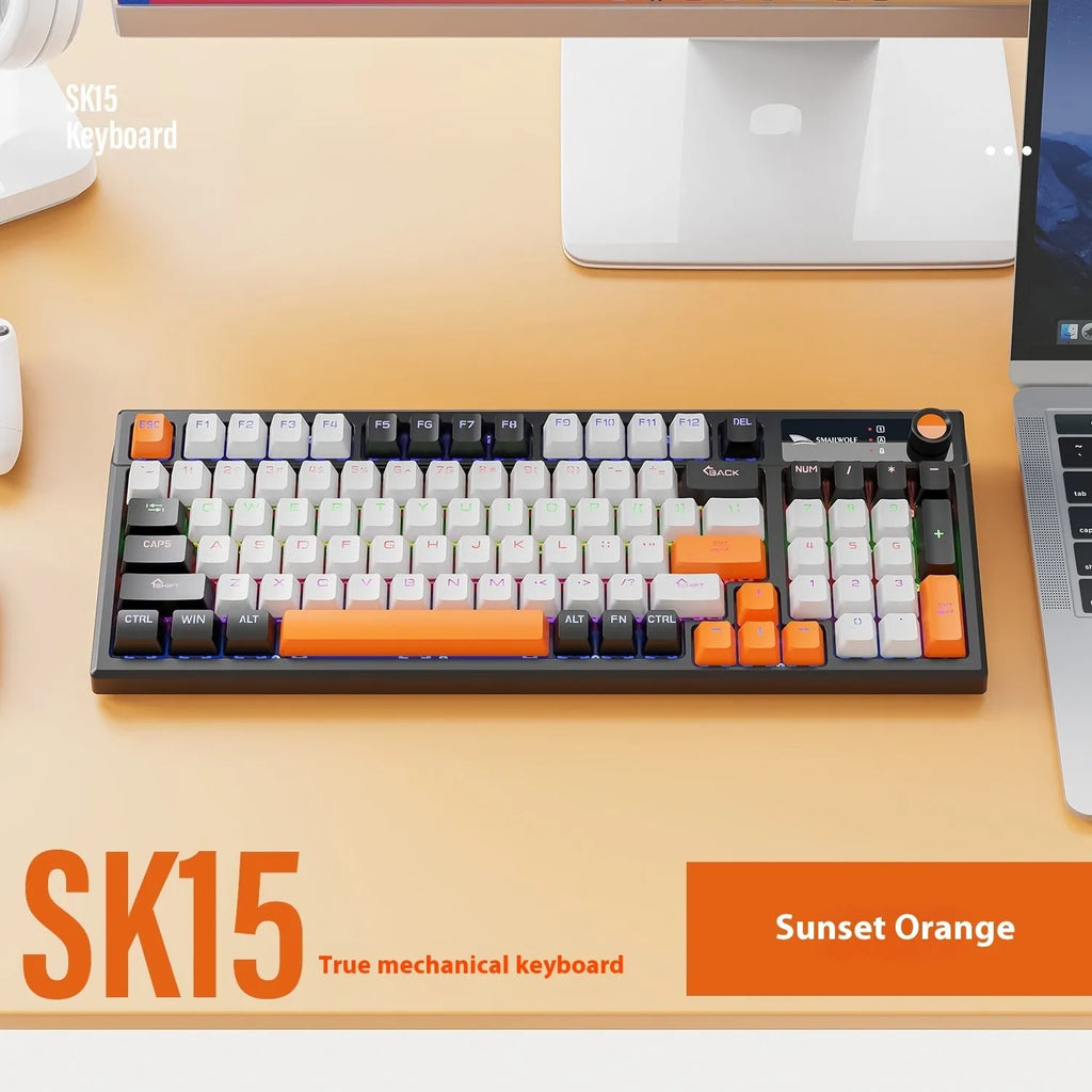 SK15 wired mechanical gaming keyboard with control knob in sunset orange colour beside notebook computer