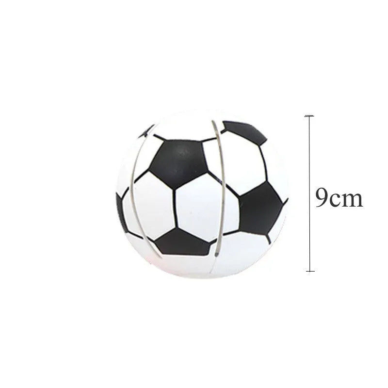 Orange glowing dog ball that transforms into a flying disc, shown on grass for scale.