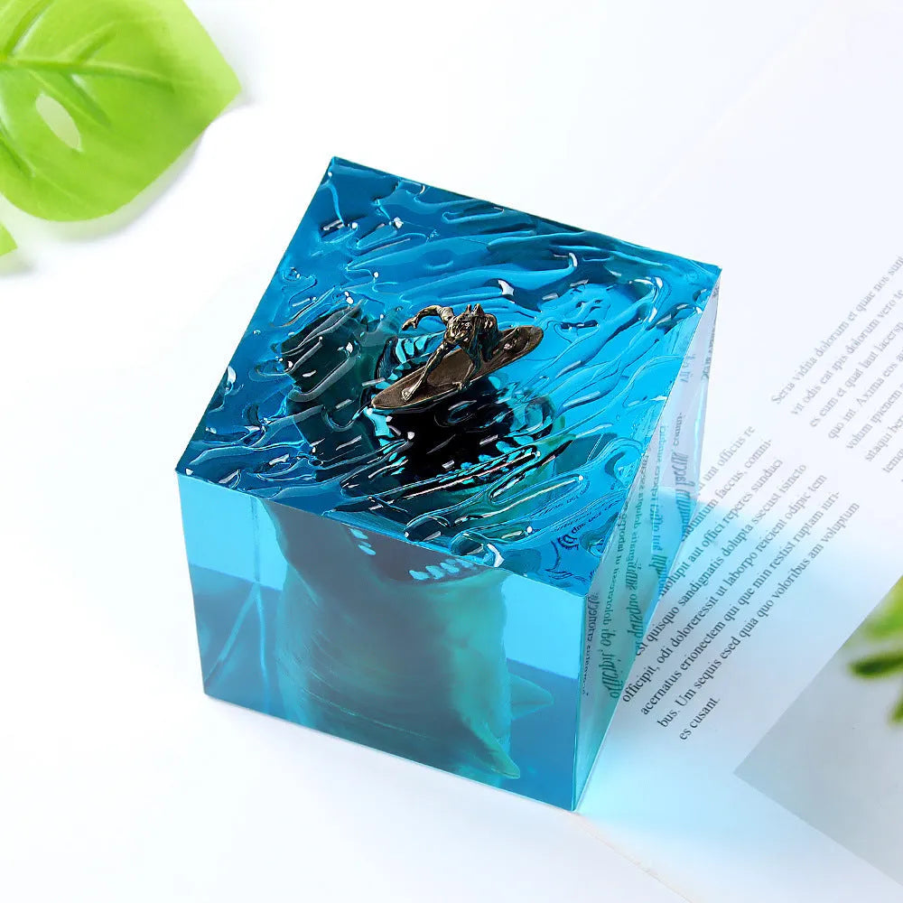 Clear epoxy resin ornament showing shark surfing on wave with integrated night light
