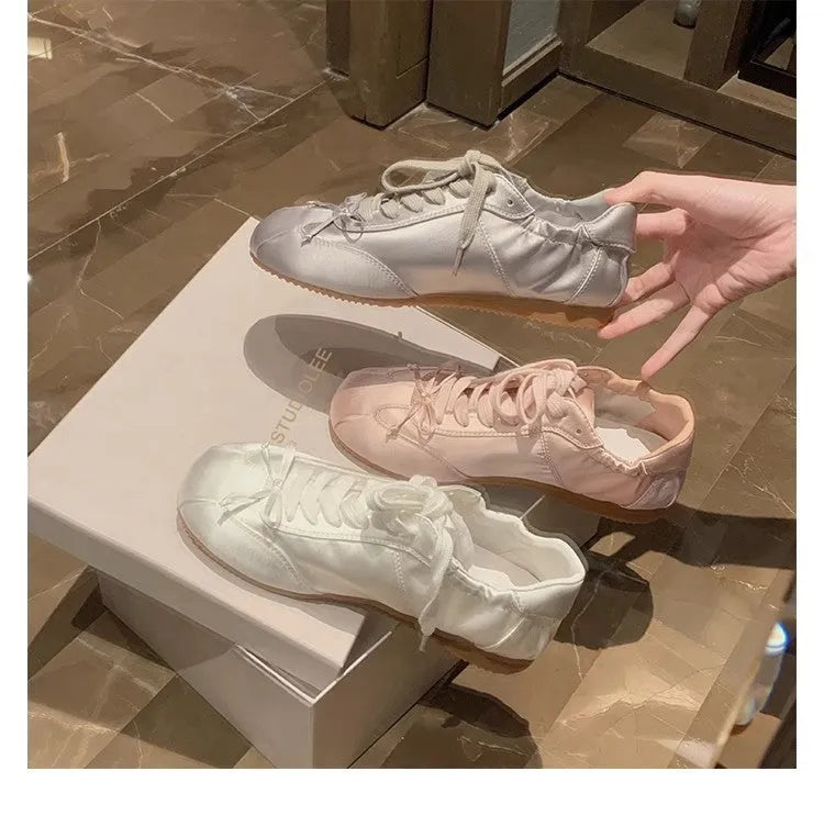 Women's ballet-style satin sports board shoes with round toe and front lace-up fastening in three colour options