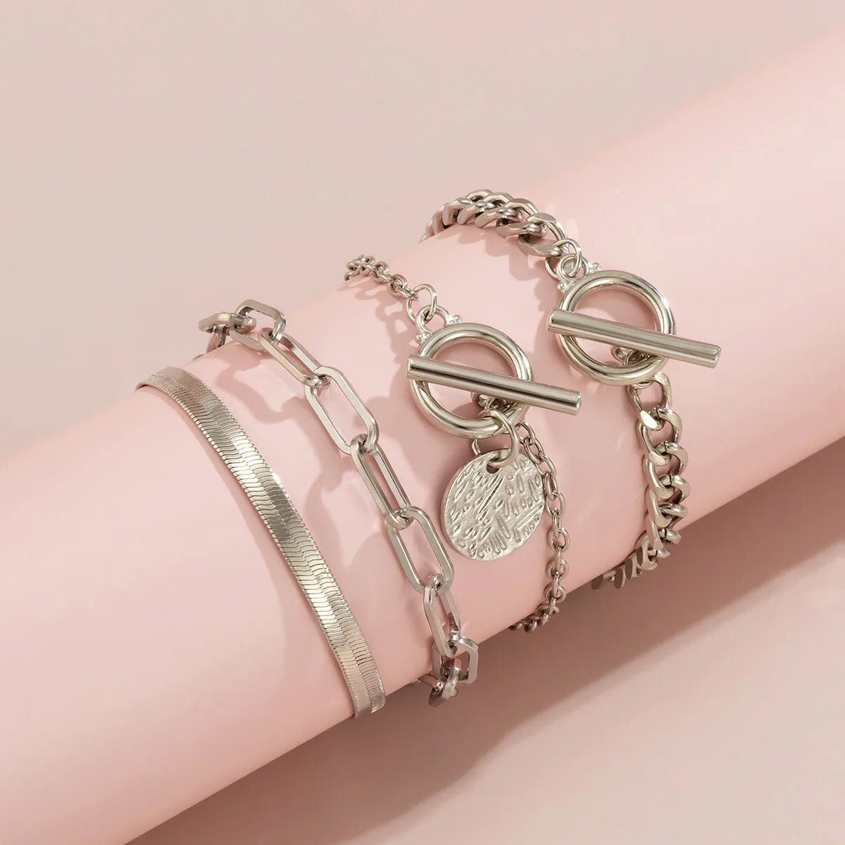 Set of 4 metal chain bracelets in gold or silver with snake bone and hollow chain designs