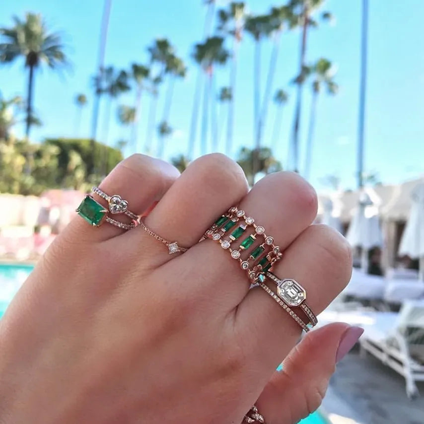 Gold-plated copper ring with hollow geometric setting and inlaid zircon stones