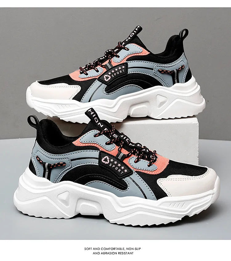 Women's white mesh casual trainers with a thick sole, round toe, and a buckle fastening detail.