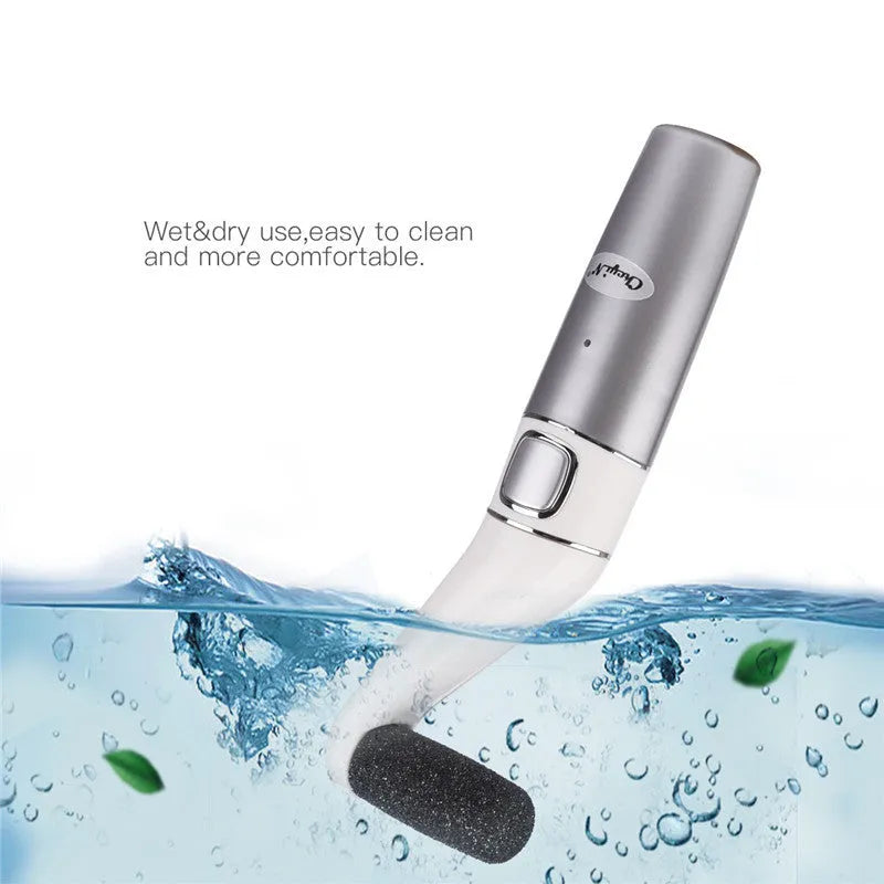 USB rechargeable electric foot file with three replacement rollers for callus and nail care, silver white ABS body on a clean surface