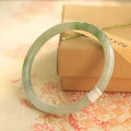 Green jade waxy geometric bead bracelet with 10mm beads and adjustable sizing options