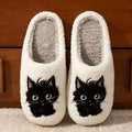 White plush slippers with Black Beard Cat cartoon couple design, showing thick construction and textured TPR sole.