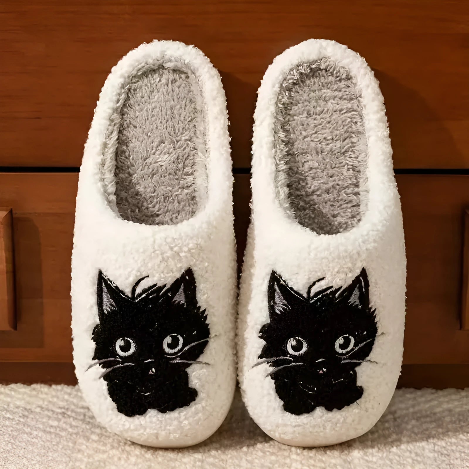 White plush slippers with Black Beard Cat cartoon couple design, showing thick construction and textured TPR sole.