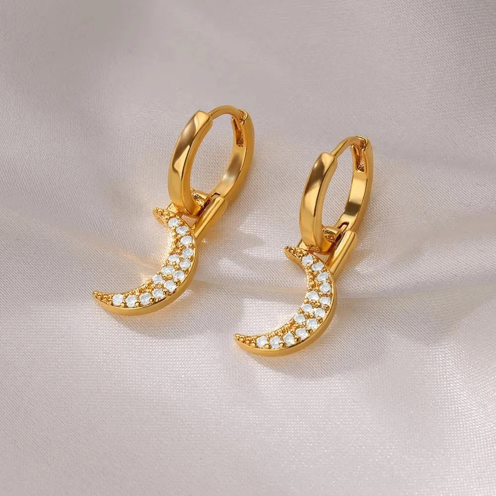 Women's copper butterfly earrings with heart and star geometric details in various colours.