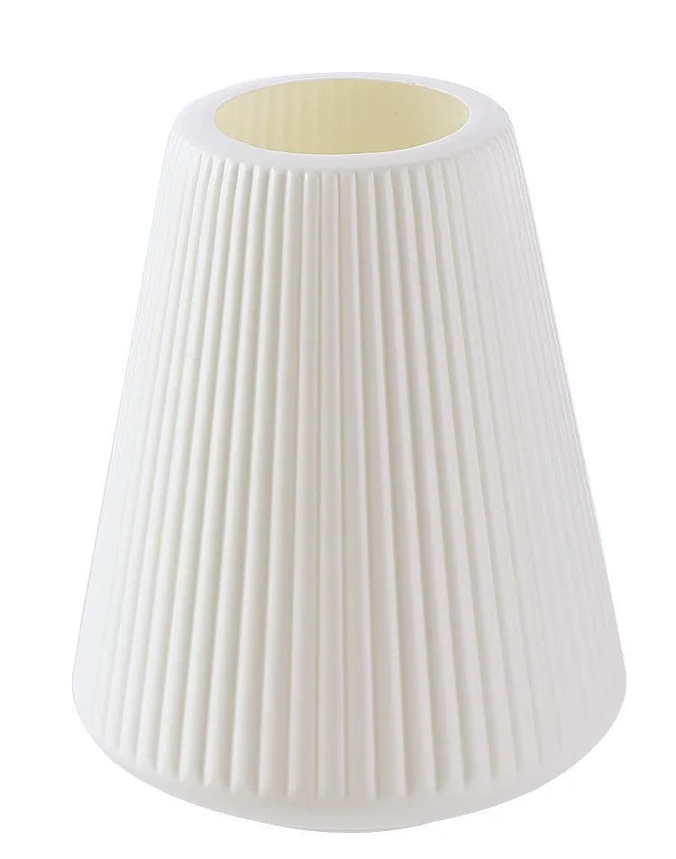 Blue, green, pink, and white melamine plastic decorative vase measuring 16cm by 20cm on a desktop.
