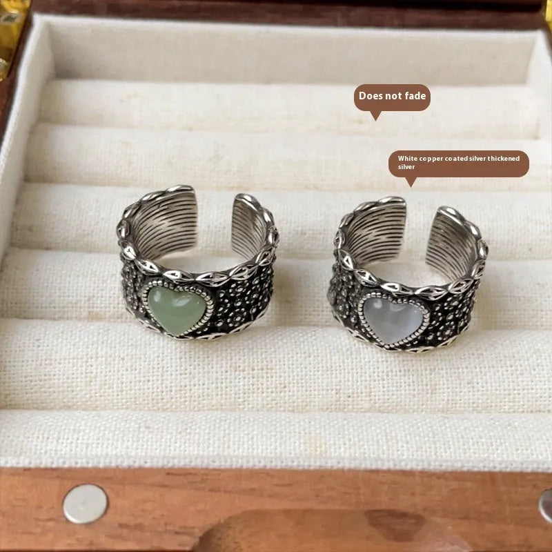 Adjustable opening love heart ring in white or green colour with retro wide-faced design