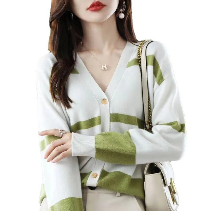 Women's black and white striped knitted cardigan with 3D pattern and V-neck.