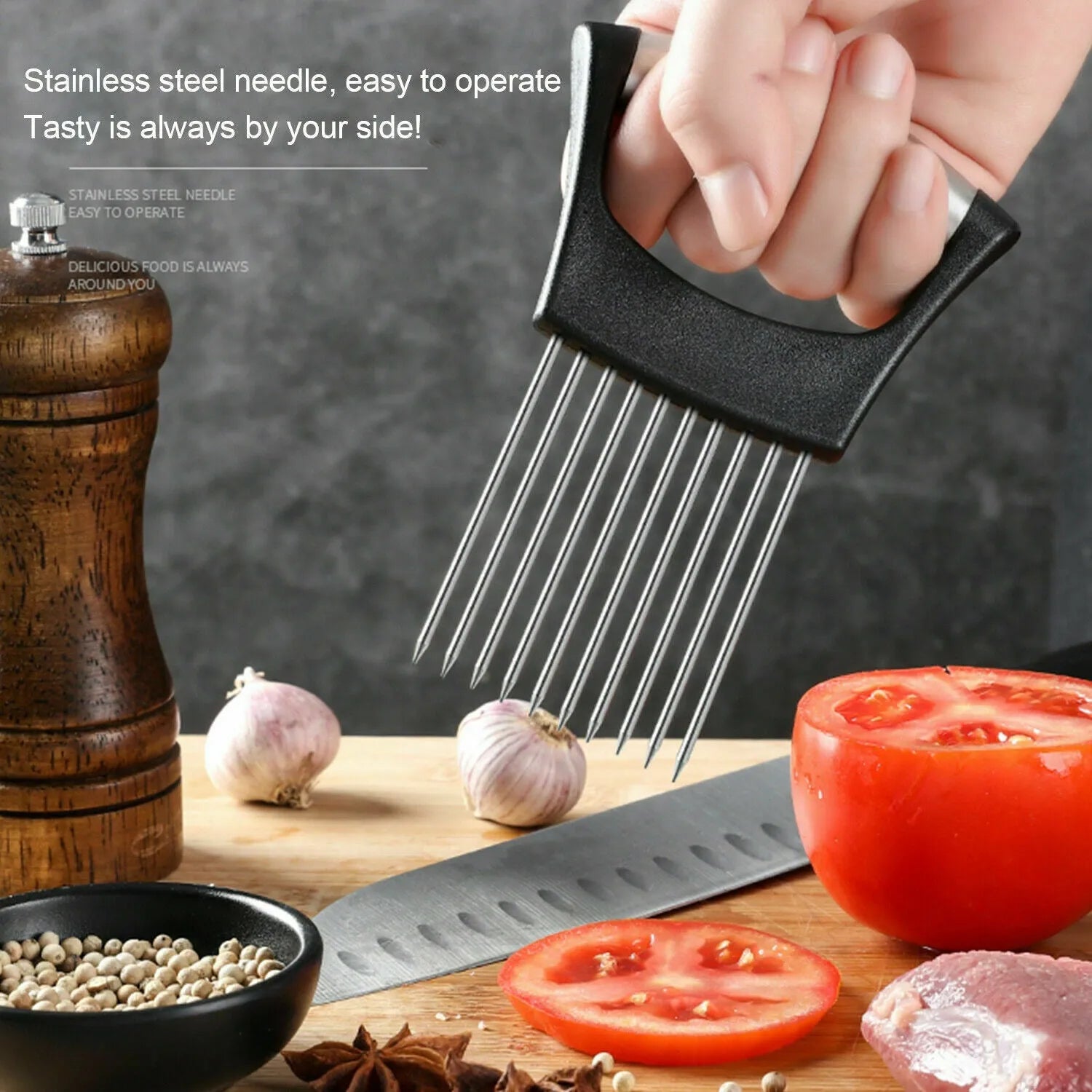 Stainless steel onion holder and vegetable slicer tool with ABS handle on a kitchen counter.