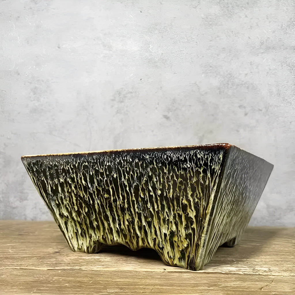 Yellow ceramic flower basin planter on a tabletop, suitable for indoor or outdoor use with small plants