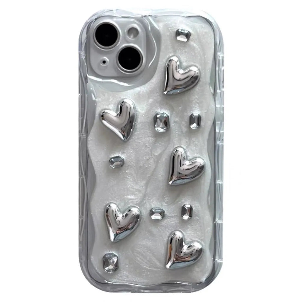 Transparent TPU phone case with three-dimensional silver love gem rhinestone heart design on white background