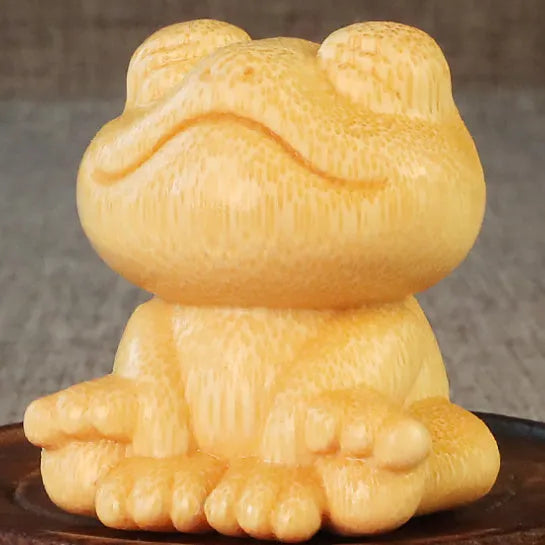 Solid bamboo carving ornament with smiling frog design measuring 5cm height