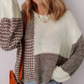 Dark khaki loose sweater with colour block design and back tie, on a model.