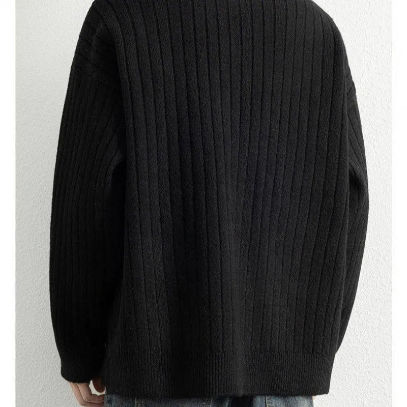 Men's loose grey half zipper textured knit sweater on a hanger.