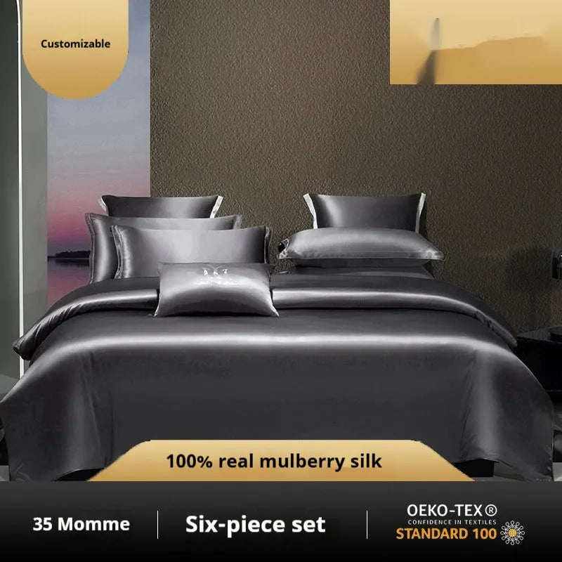 Solid colour silk quilt cover set on a bed, showing duvet cover and pillowcases in a champagne gold hue.