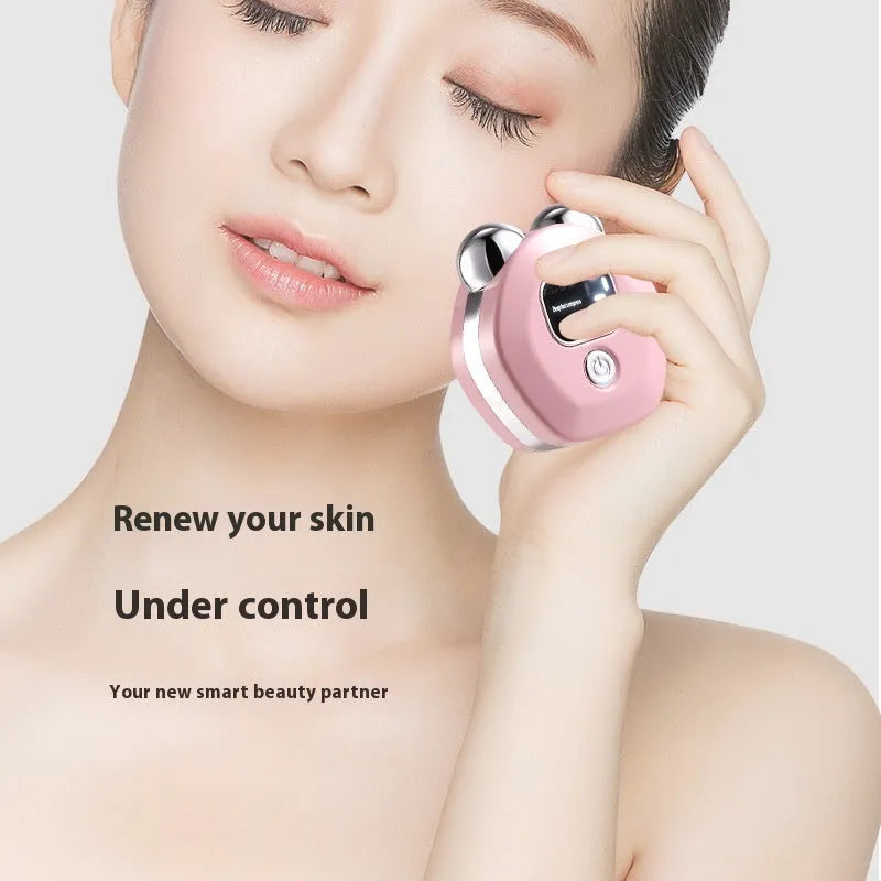 Portable white facial massager with hot compress, micro current, and double roller head for skin rejuvenation.