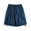 Prussian blue men's nylon beach shorts with loose fit and embroidered detail