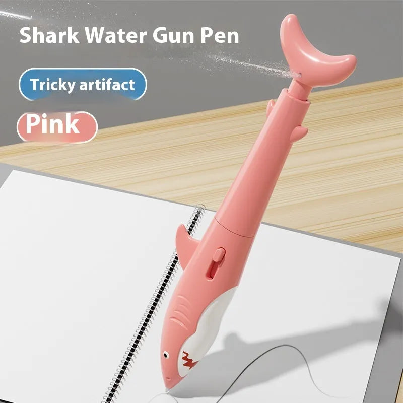 Shark water gun pen in blue plastic with press mechanism for water spray, on white background