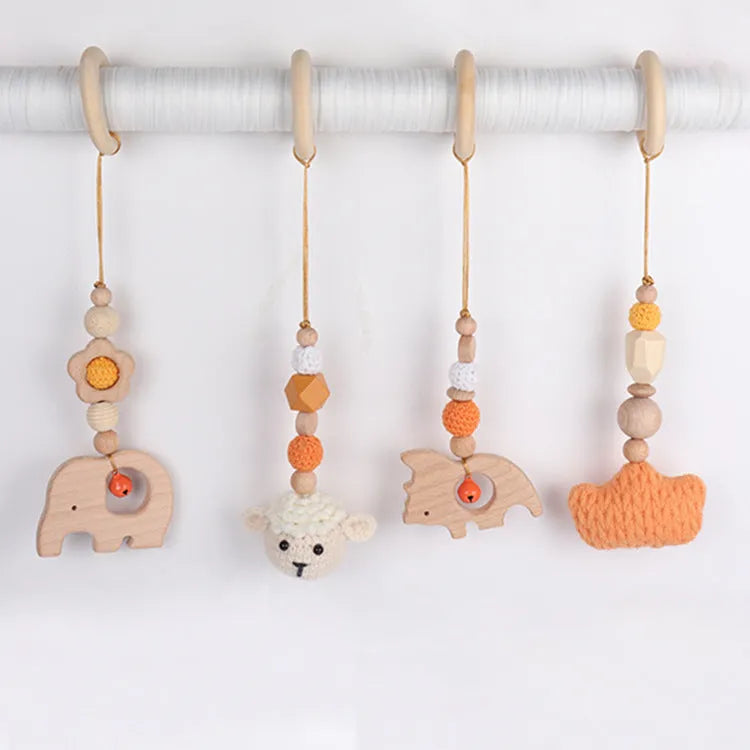 Beech wood baby rattle toy with animal decoration, 28cm long, available in six colours