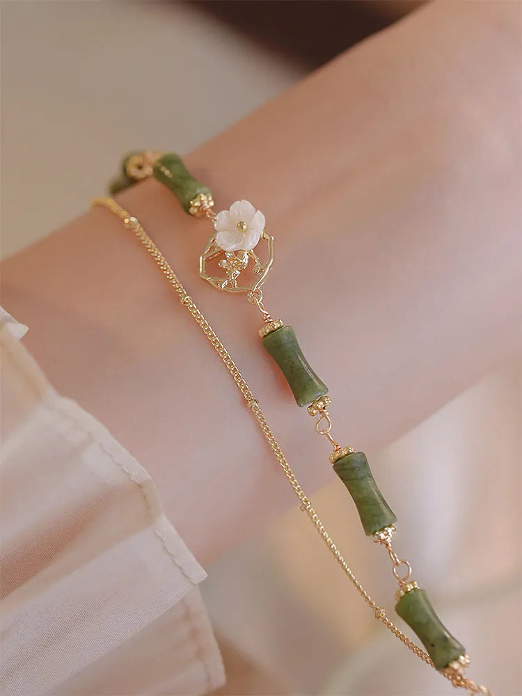 Natural olivine double layer bracelet with braided cord and Bells of Ireland design