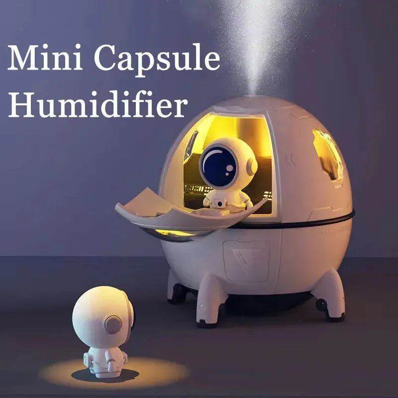 Light purple astronaut-shaped desktop humidifier with LED lights and USB cable