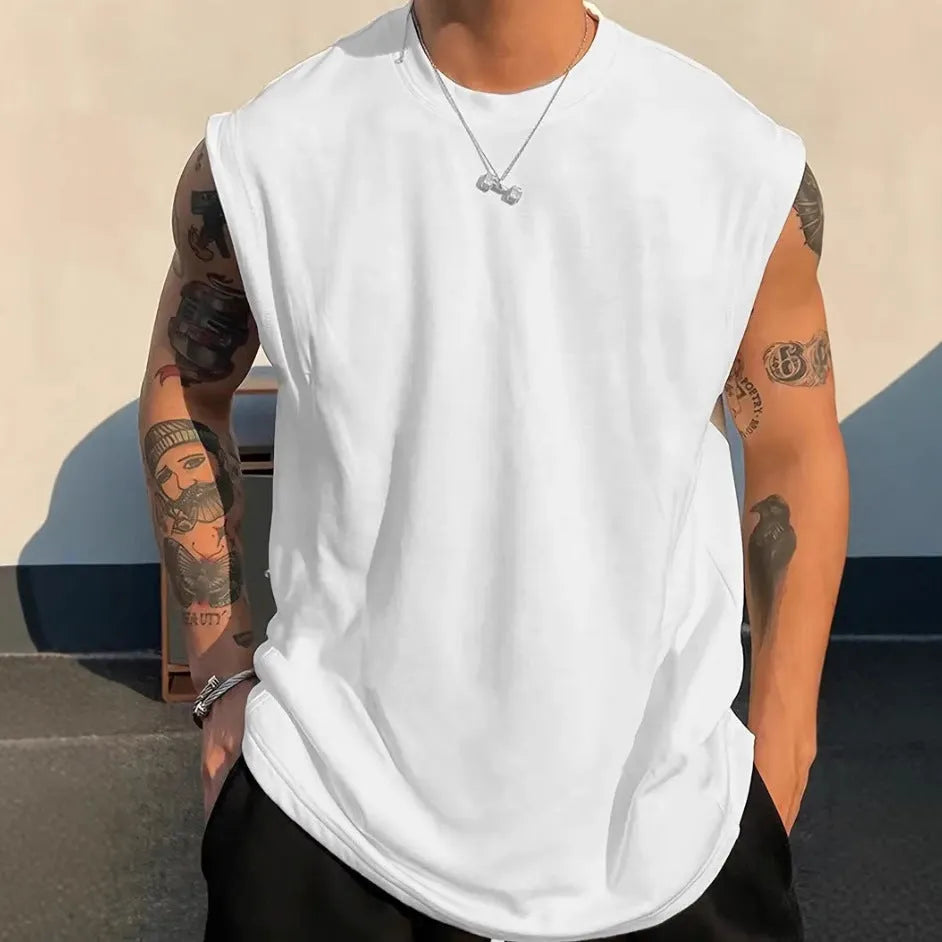 Men's loose solid colour cotton pullover tank top on a hanger, showing sleeveless design.