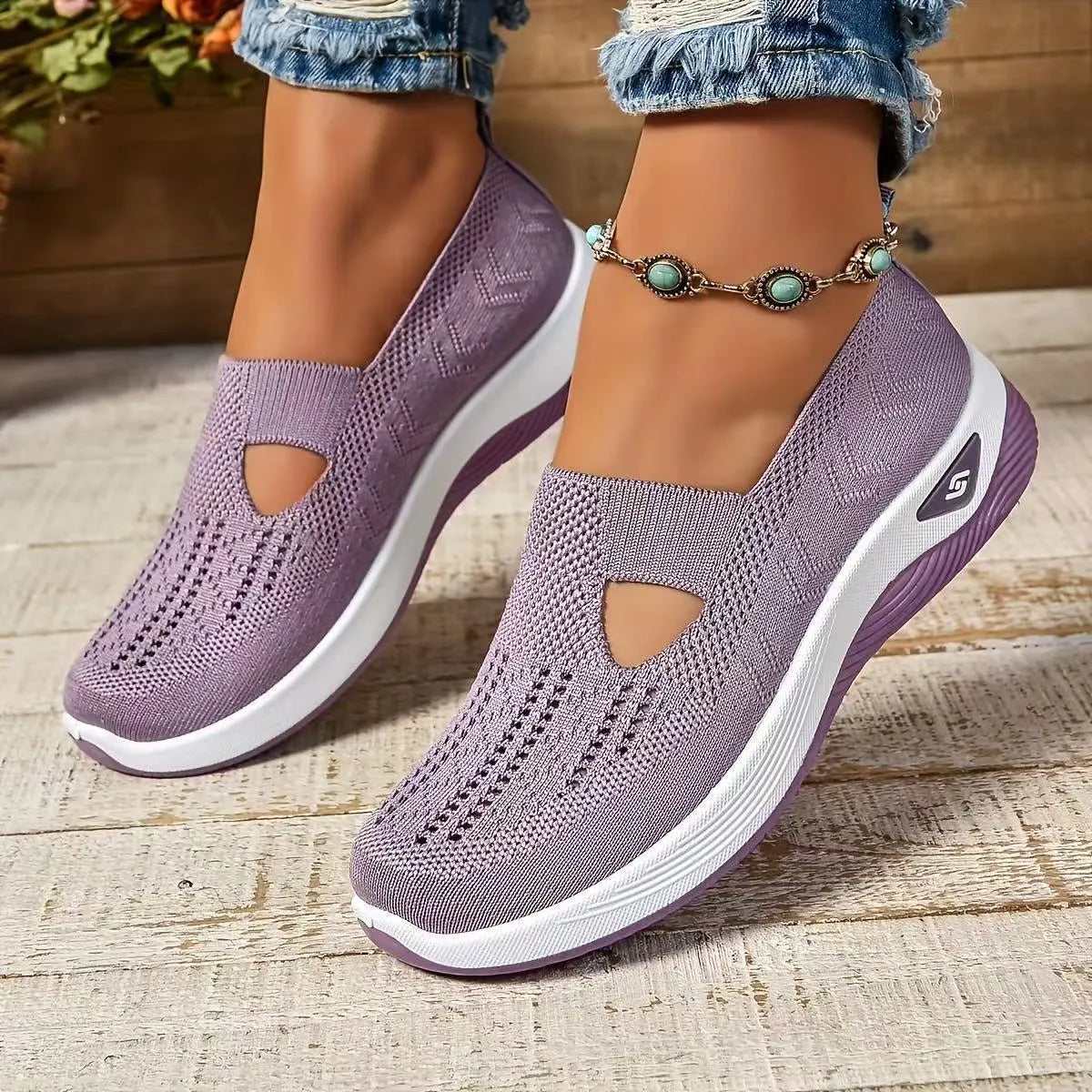 Women's light grey mesh casual flats with a T-strap and round toe on a soft PVC sole.