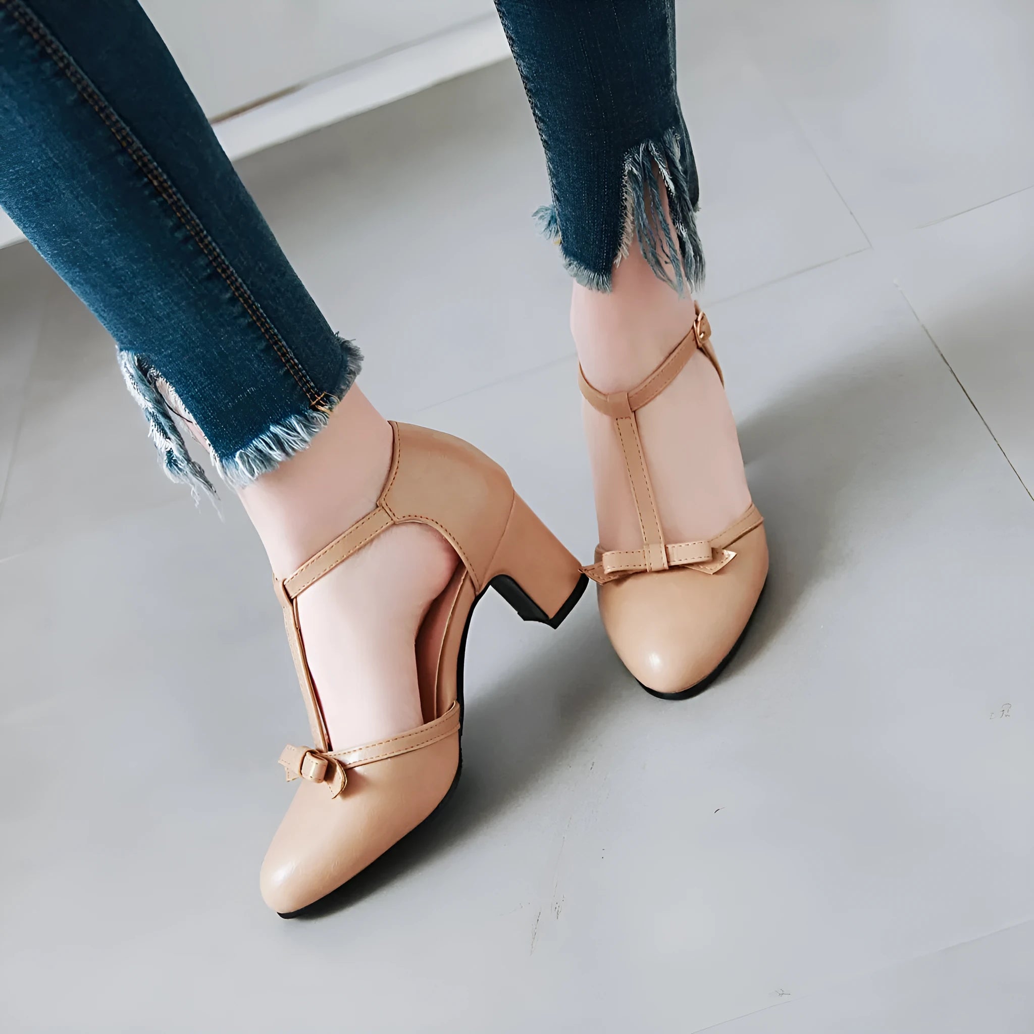 Women's apricot chunky heel sandals with hollow-out round toe, bow detail, and a buckle strap on a 6.5cm heel.
