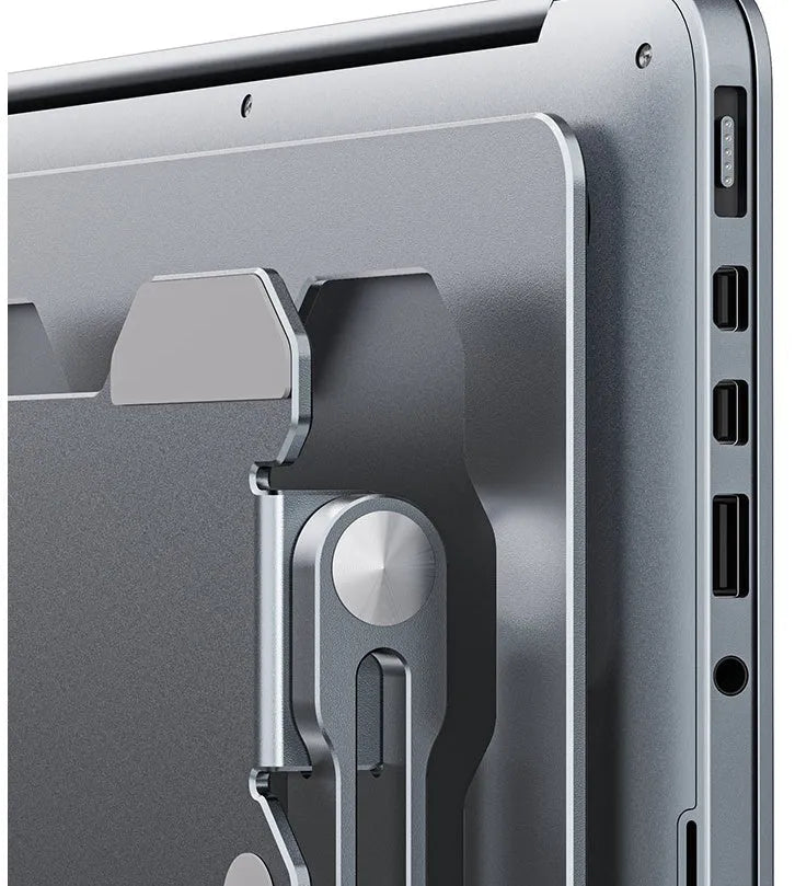 Grey adjustable aluminium laptop stand in open and folded positions on a wooden desk.