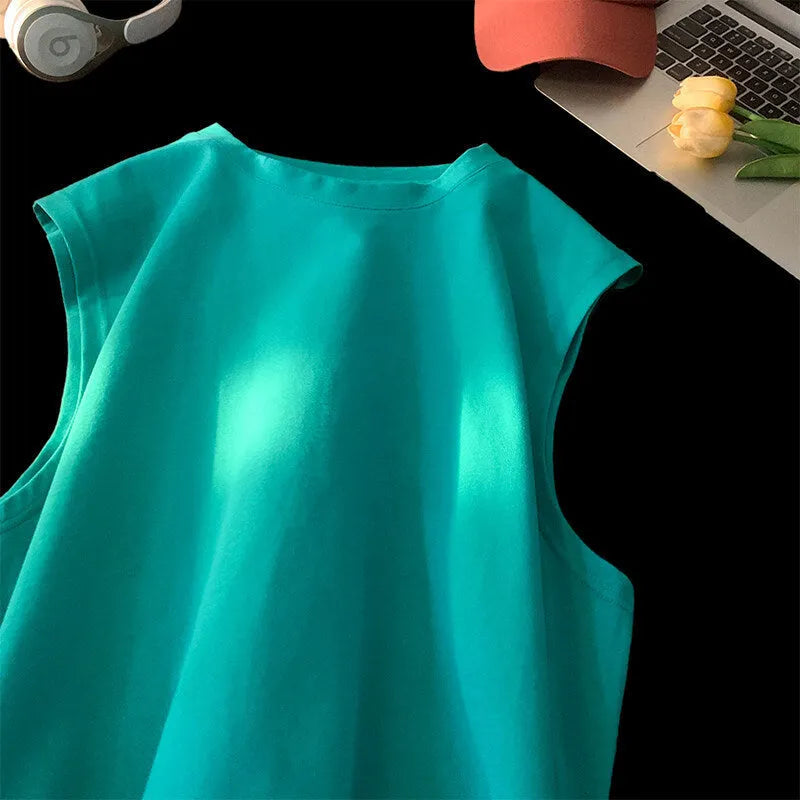 Men's loose solid colour cotton pullover tank top on a hanger, showing sleeveless design.