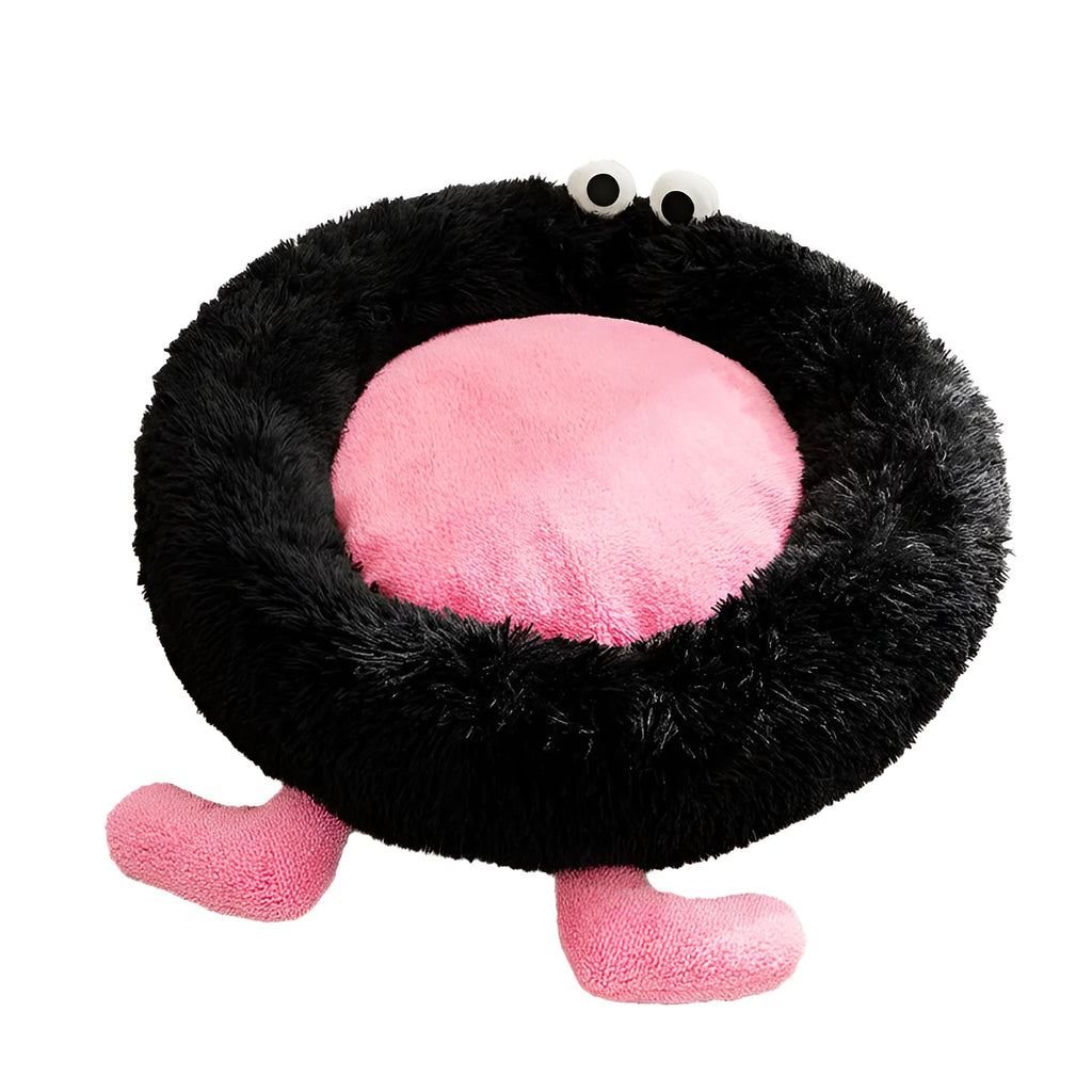 Blue Elf Briquettes plush kennel pet bed with raised bolster edge for dogs or cats, shown in a home setting.