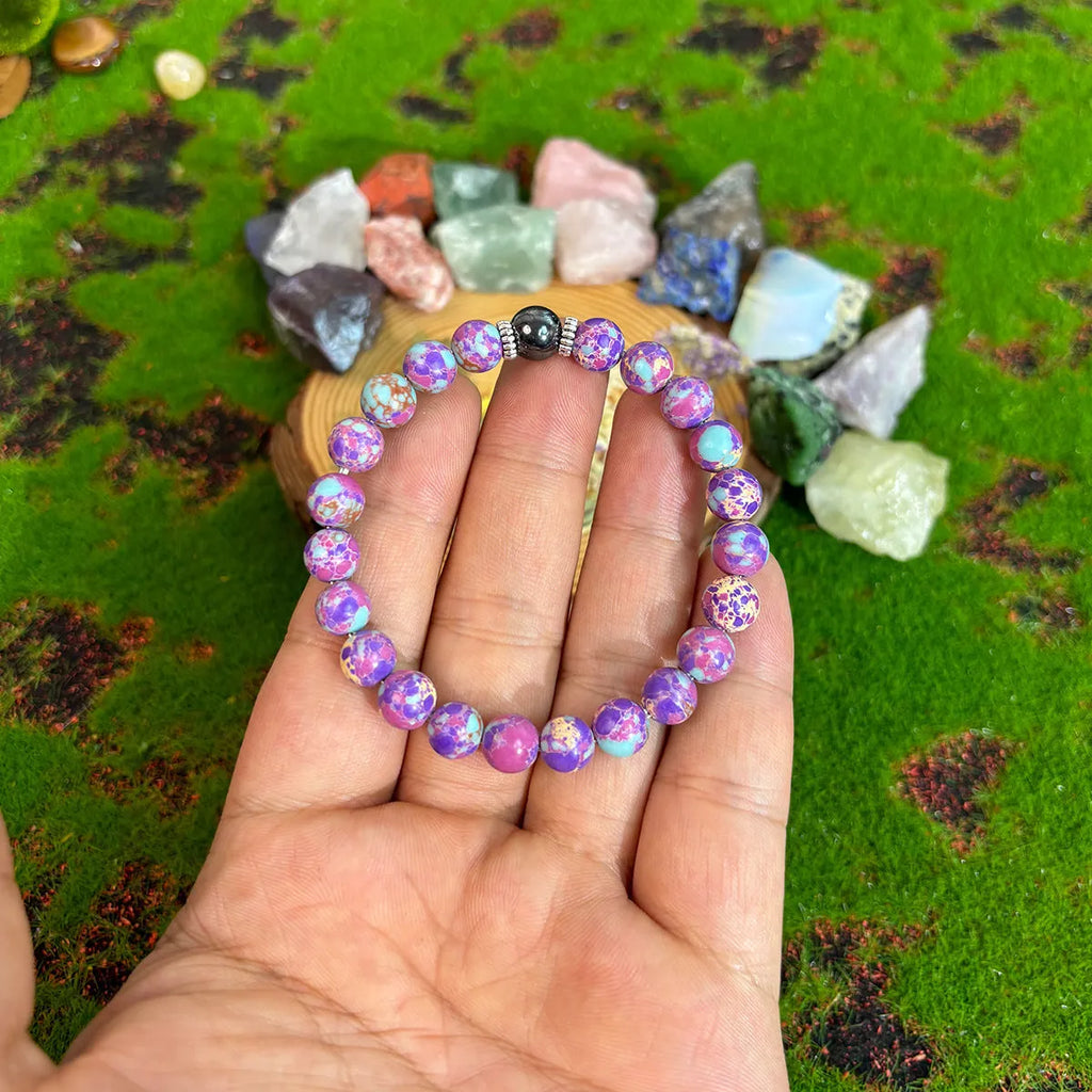 8mm geometric glass and coloured glaze beaded bracelet on elastic string, transparent colour, unisex handmade design