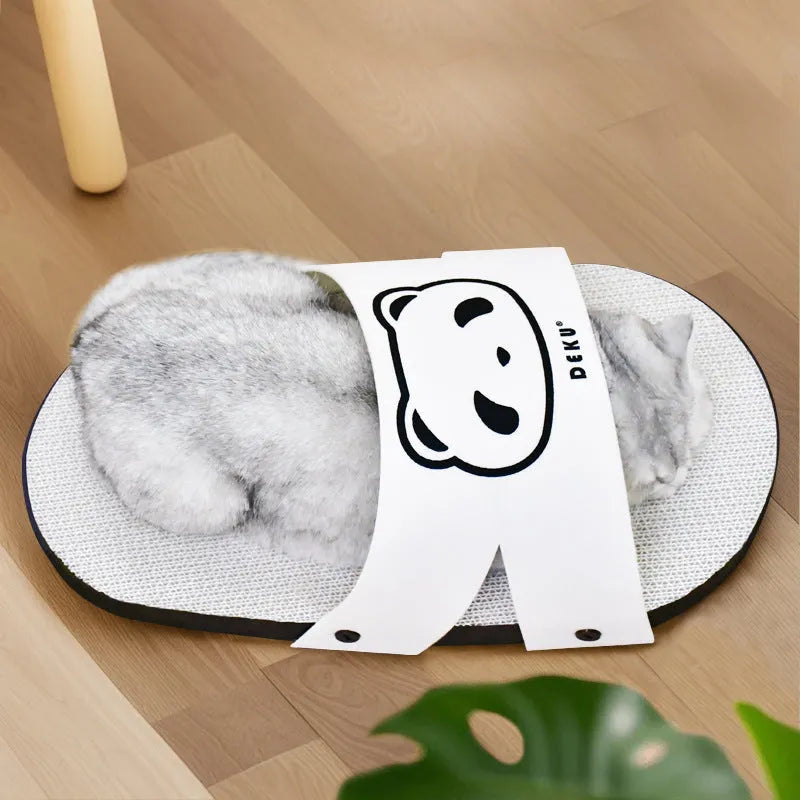White corrugated paper cat scratch board in a slipper shape on a floor.