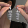 Silver pagoda Christmas tree drop earrings with sparkling zircon elements on copper construction
