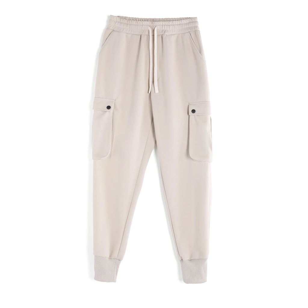 Men's loose fit cotton sports trousers with ankle ties in apricot colour showing multiple pockets