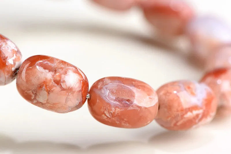 Natural cherry agate barrel bead bracelet with geometric 10x14mm beads and ruyi design