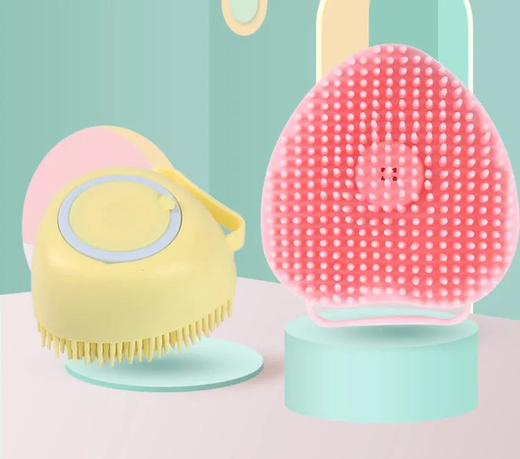 Silicone dog bath brush in blue, pink and yellow colours with soft rubber bristles and ergonomic handle